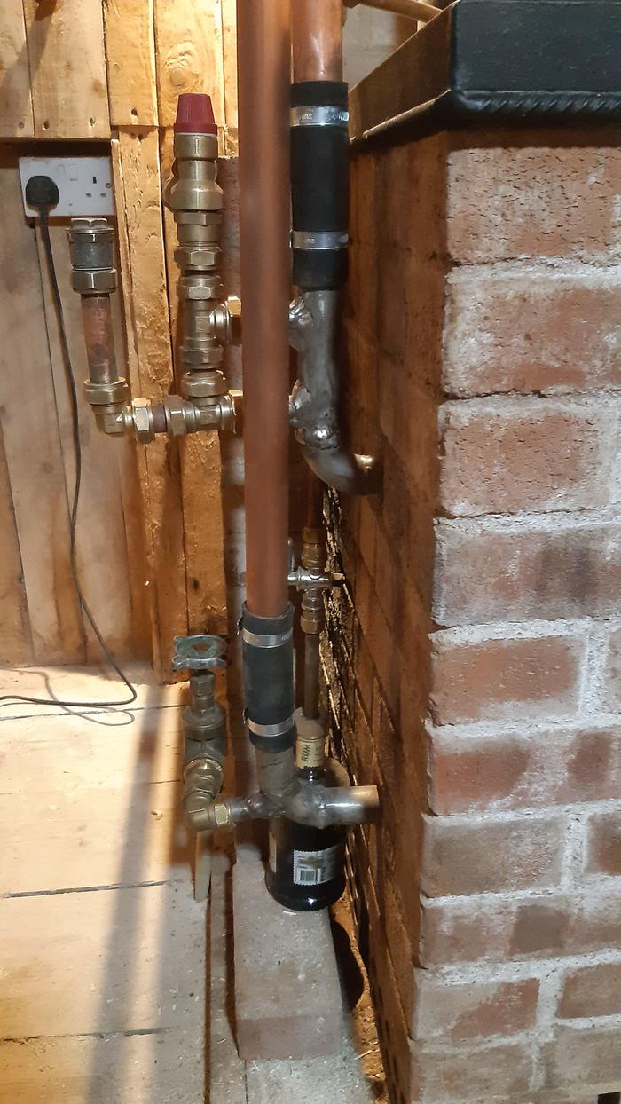 front view of valves and pressure relief valves built into a rocket stove