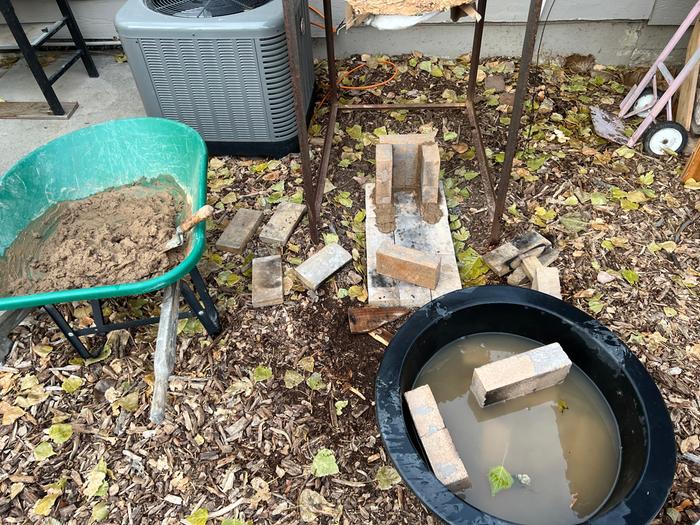 Soaking then laying bricks