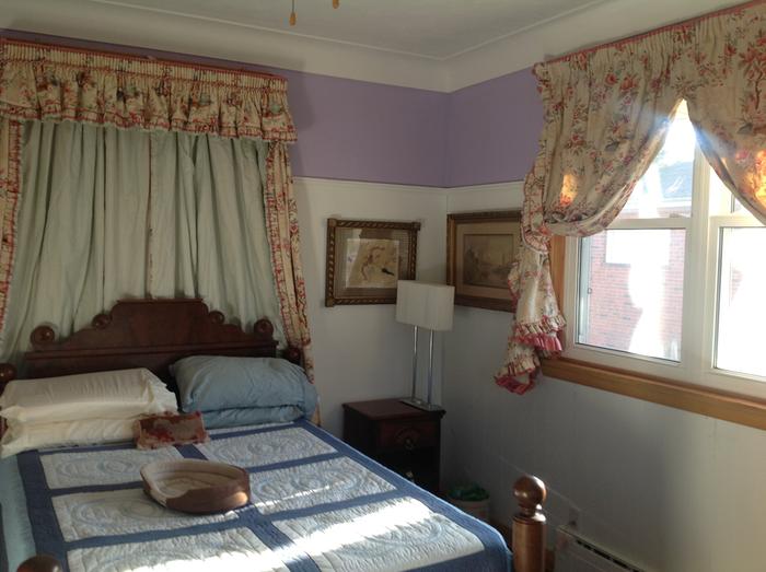 guest bedroom with new drapes from reused curtains