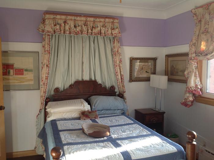 guest bedroom with new drapes from reused curtains