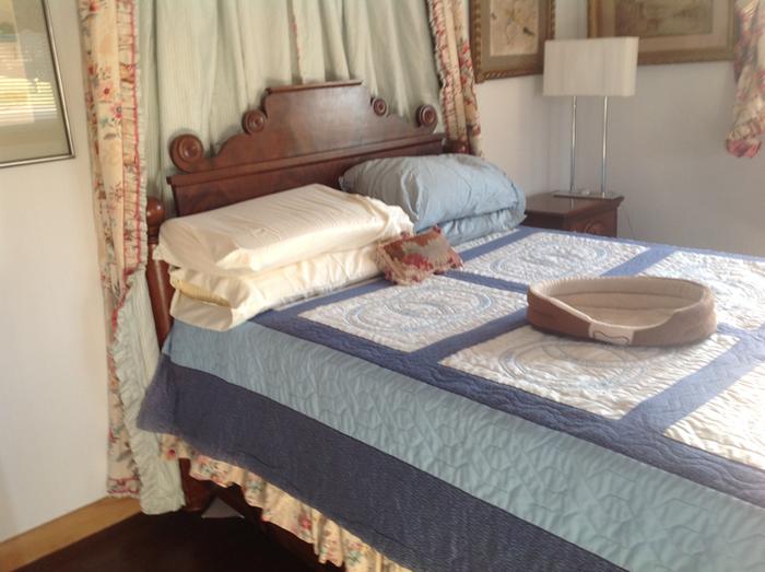 guest bedroom with new drapes from reused curtains