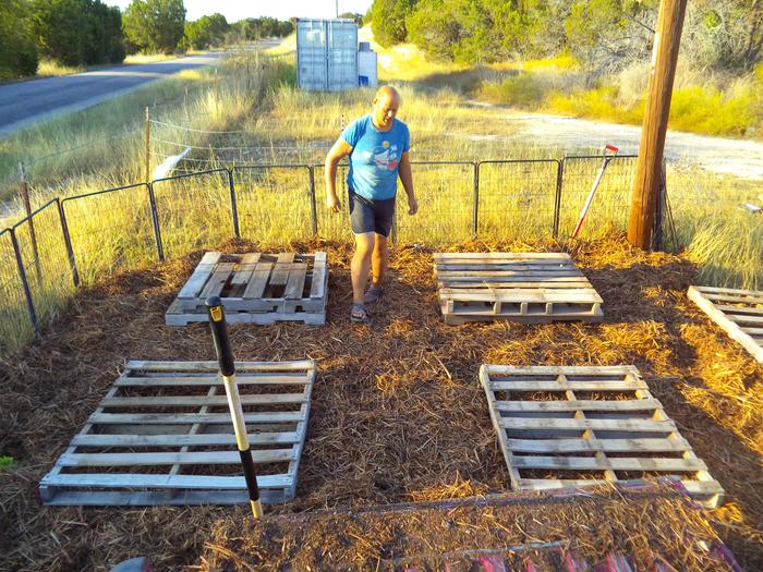 stacking pallets for a water tote, and 3 planting stations