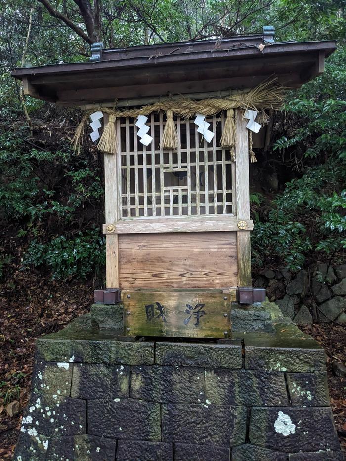 A small shrine showing clear wood weathering