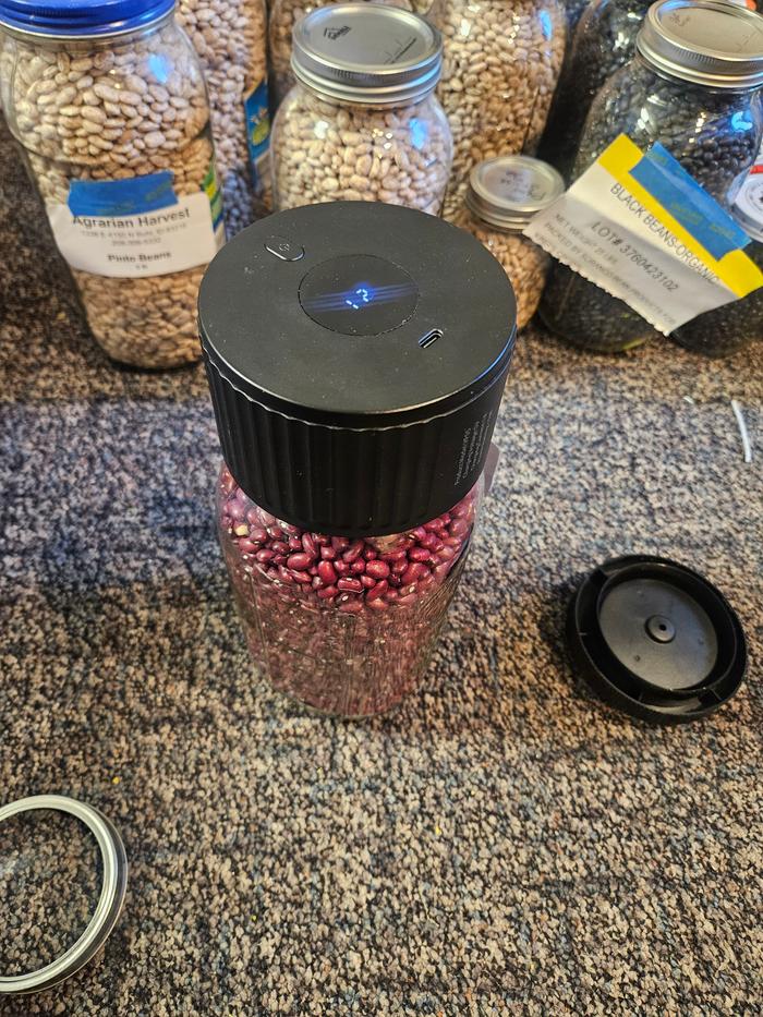 Air-sucker-thing. Works in all jars with normal canning rings. The jelly/pickle jars use the lid-poking kind. They have a little black tape over the holes