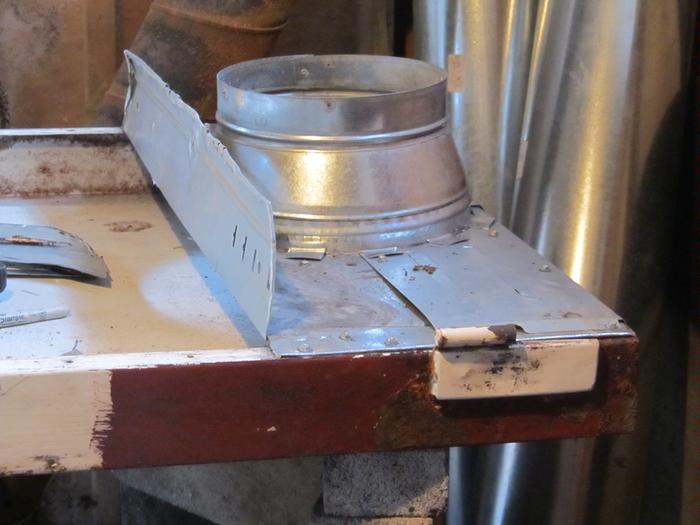 chimney connection end of pan base