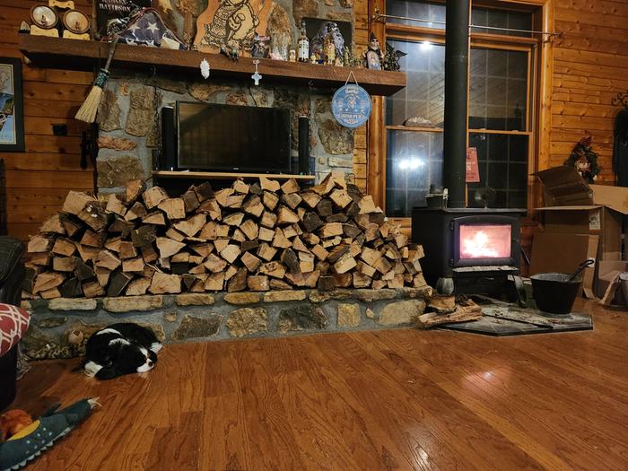 Log-hog to the right of the dead fireplace. 