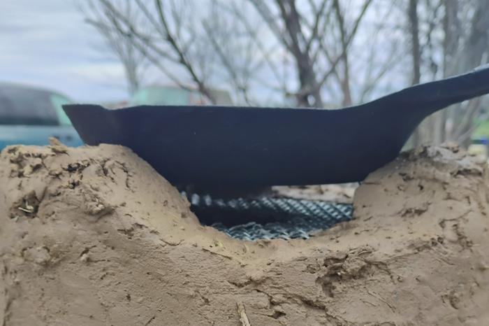 Smaller pots and pans fit inside, and there's a built in grill for a camp coffee cup