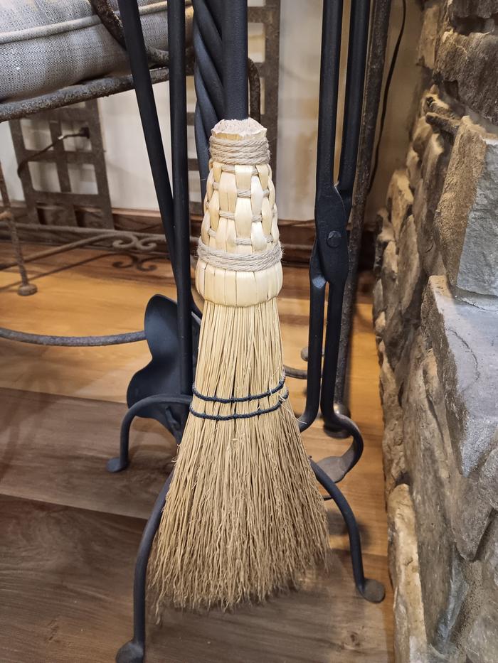Fireplace broom seen in a restaurant 