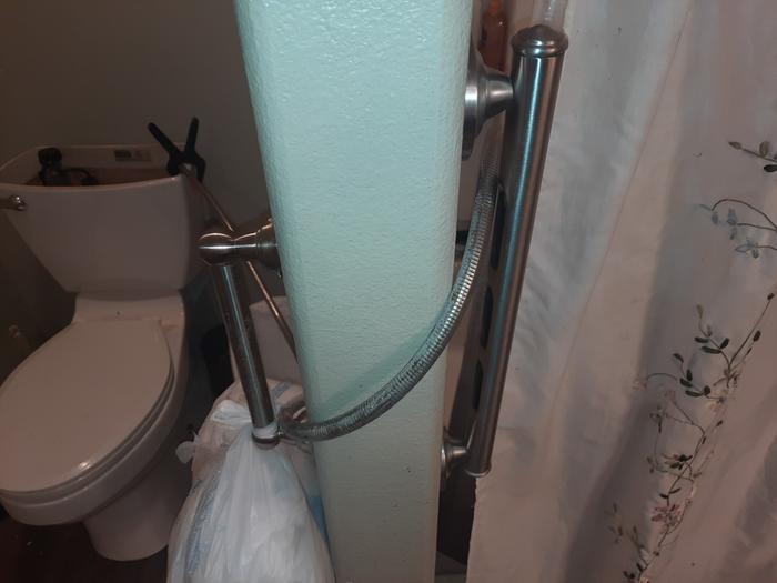 Extended shower hose to toilet.