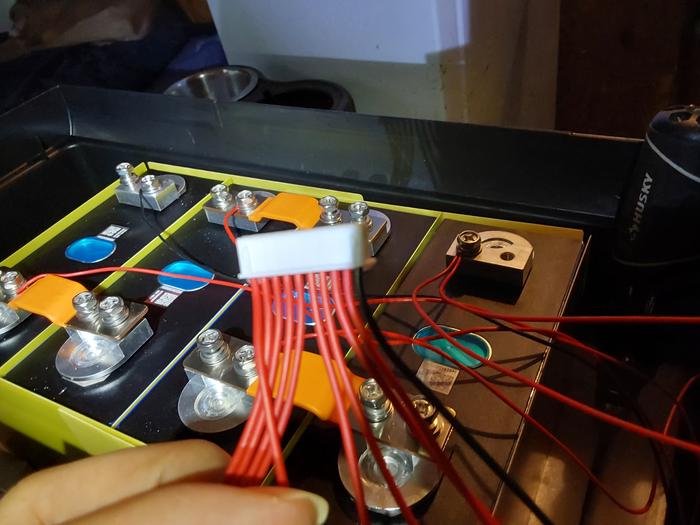 Per the list, connect the bus bars and the balance wires, starting from the black/negative wire, and following each of the positive cells, plus the last red wire for BMS power