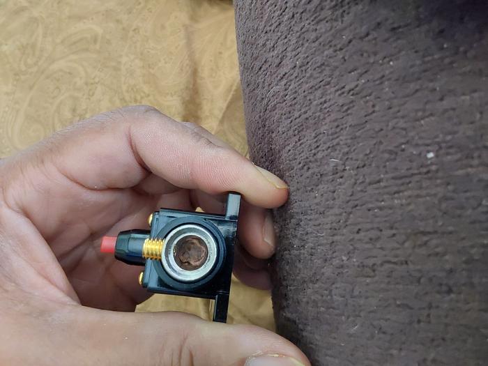 Back the set screw out or remove it. 