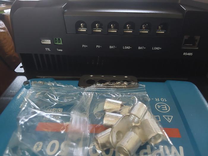 The terminals are compatible with ring terminal lugs, once you take the cover off