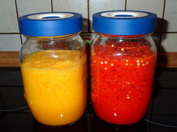 Yellow and red hot peppers fermented for a year, to turn them into hot sauce.