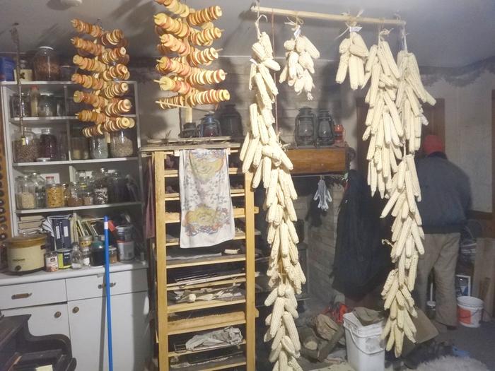 we had dry corn, apple rings, and a bunch of seeds on that wooden rack tower all drying in the late fall