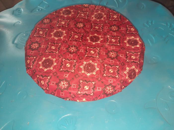 It's not as sticky as cling wrap, but this bowl has a rim. Cranking it down to that, I was able to get it pretty taut.