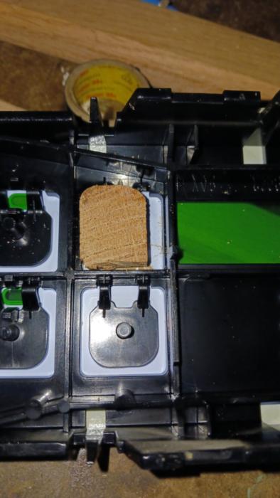 A piece of wood in the button housing of a GE oven