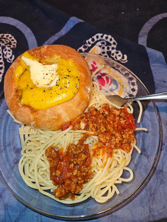 Coconut Squash soup in a bread bowl with spaghetti!