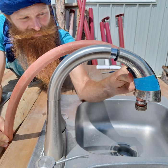 Attaching a hose to the faucet 