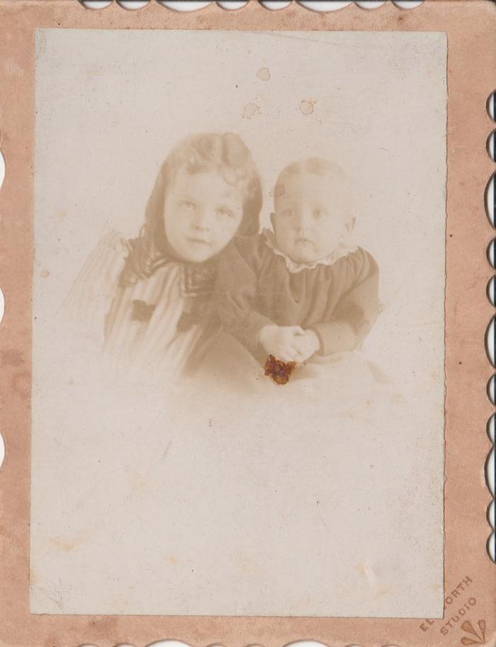 old family photo of two young children
