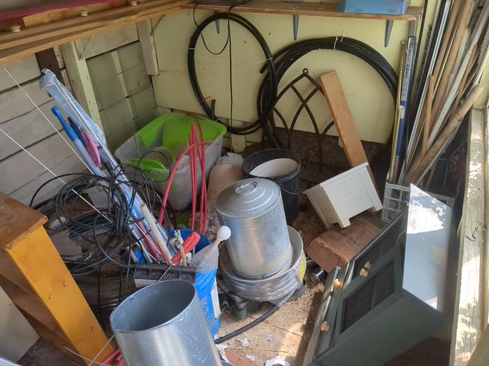Here's all the stuff inside the shed. The chicken feeder and waterer I put in there after being gifted them from a friend.