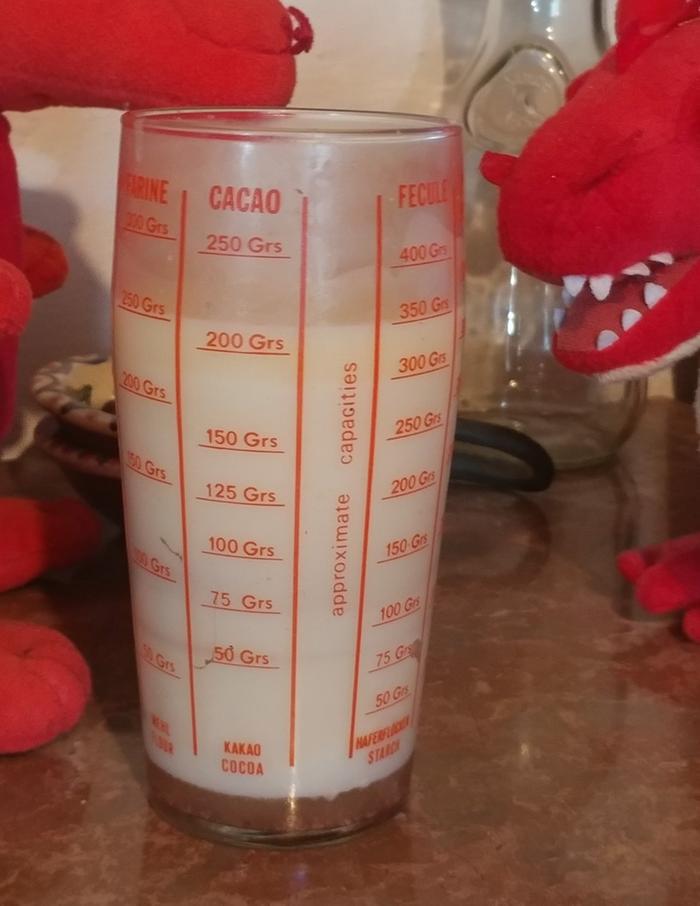 measuring glass showing differences between ingredients