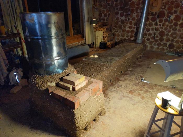 a rocket masonry heater with its cob installed