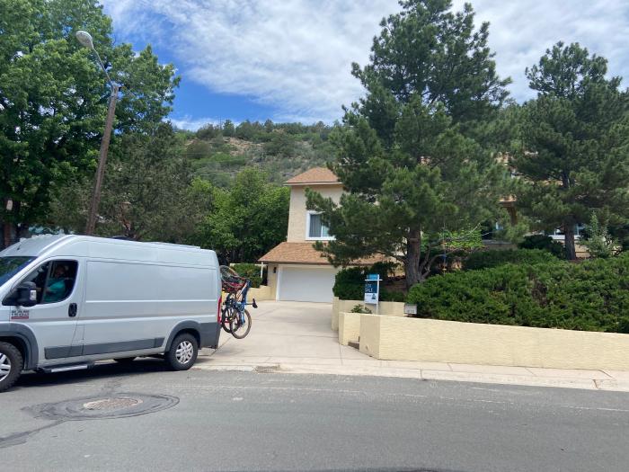 The Maleckis pull away from their home in a silver van with bikes on the back