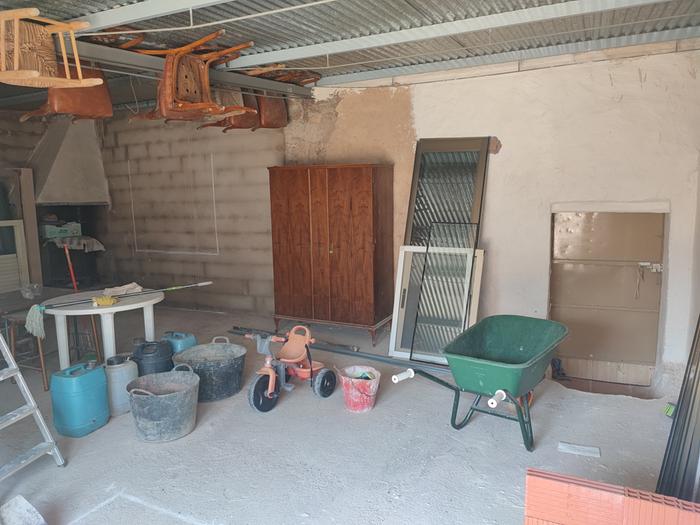 Wide view of wood stove in proposed new kitchen