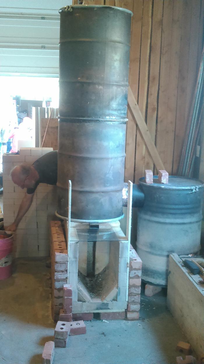 Peter builds exterior masonry onto the 8