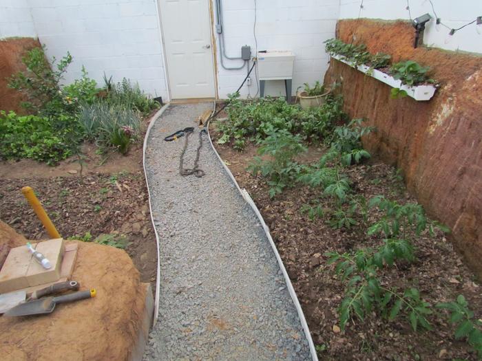 greenhouse interior showing path and growing beds
