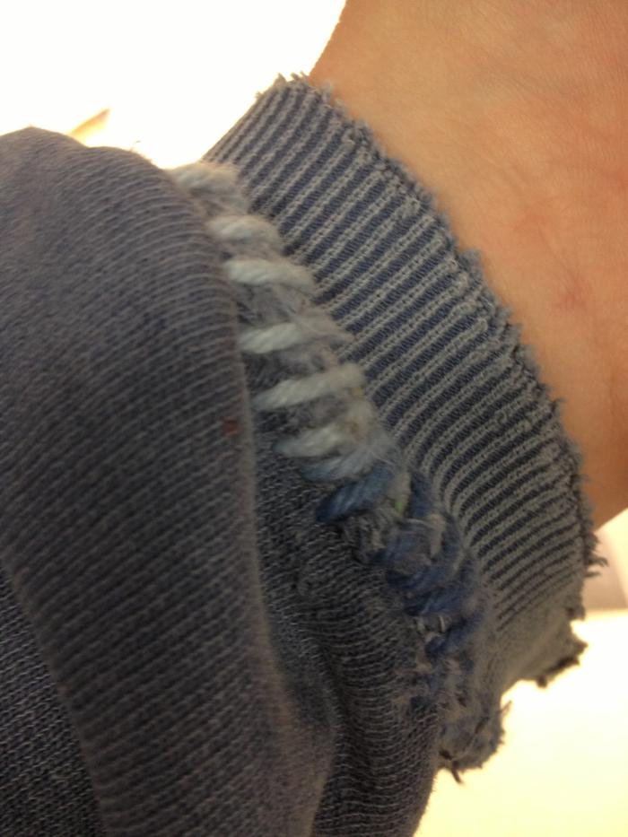 roughly sewn up with yarn