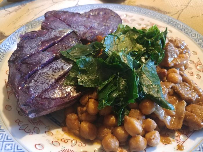Spicy pork and chick-peas with purple sweet potato and galega cabbage