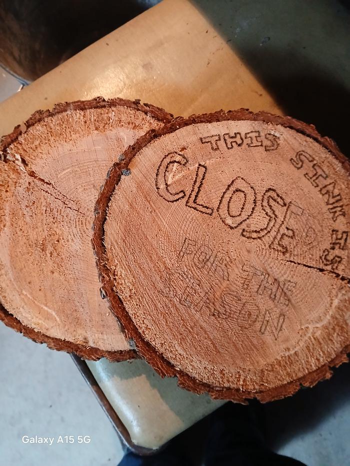 a woodburned sign that says 