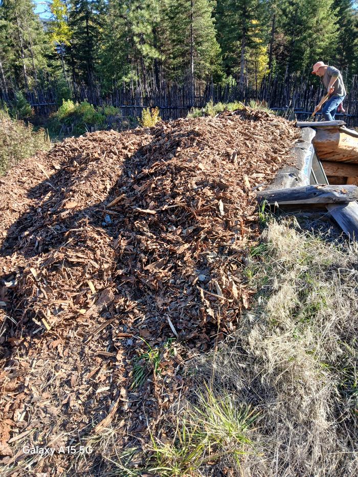 mulch on top of a wofati house