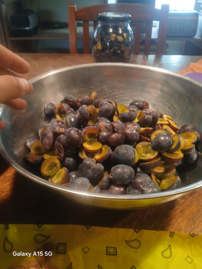 a bowl of pitted plums