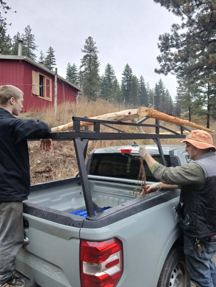 Loading up replacement garden gate to be hauled closer to worksite 