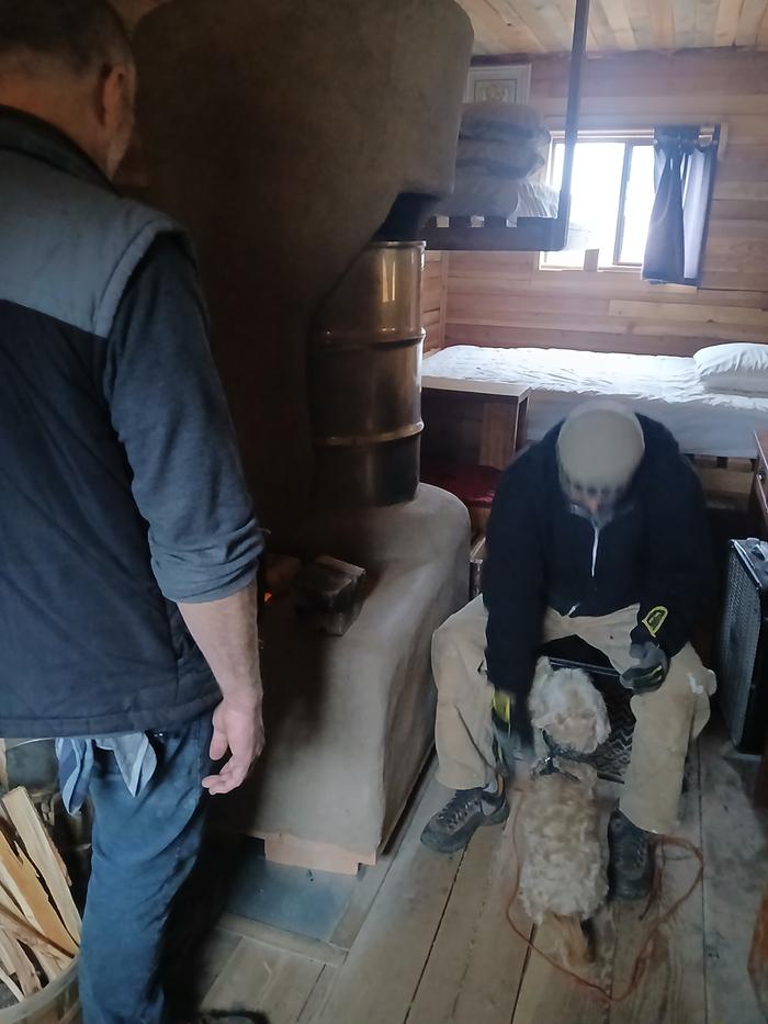 The high commander and John lighting up rocket mass heater at red cabin 