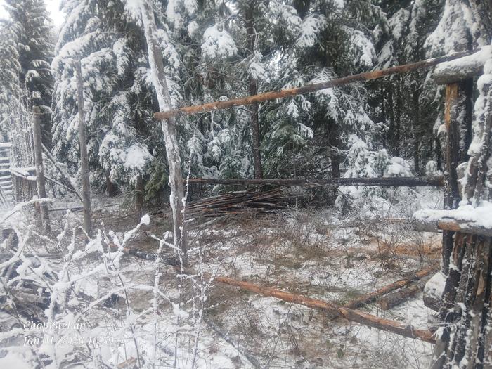 horizontal poles set in a junkpole fence