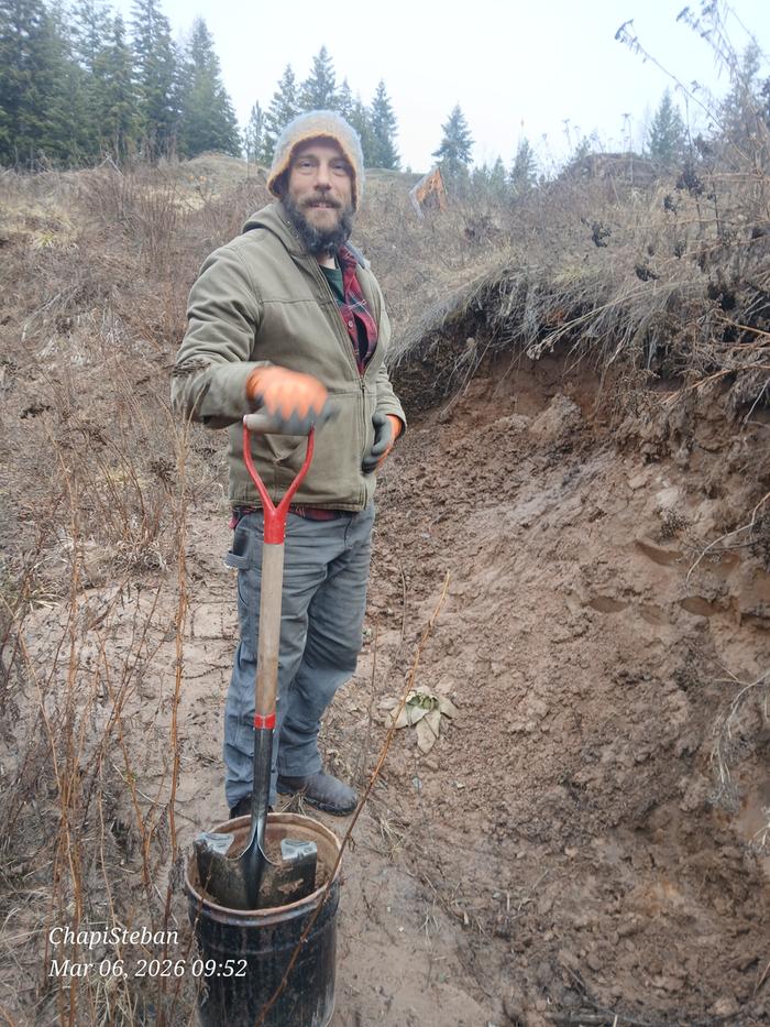 Harry collecting a buckets worth of soil 