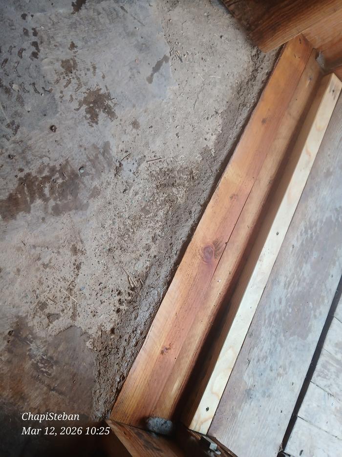 a new layer of cob next to the repaired lintel