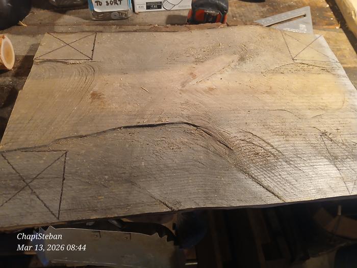 marks on the four corners of a slab of wood