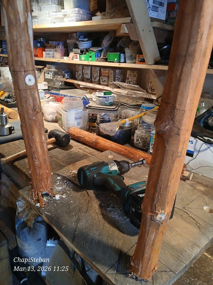 First two legs installed in the end table, with a hole for the stretcher