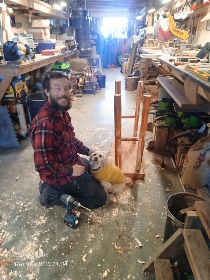 Harry and Chapi smiling next to the inverted end table with all four legs installed