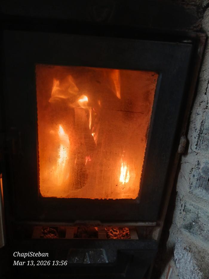 a fire in a batch rocket masonry heater