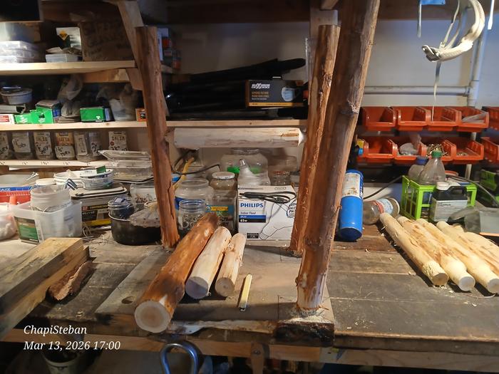 Three legs and a stretcher installed in a table