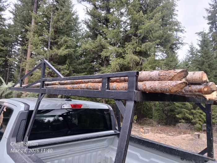 Hauling junkpoles near tipi site, staged inside the Abbey 