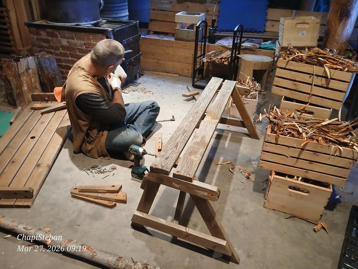 Stephen dismantling a picknick bench 