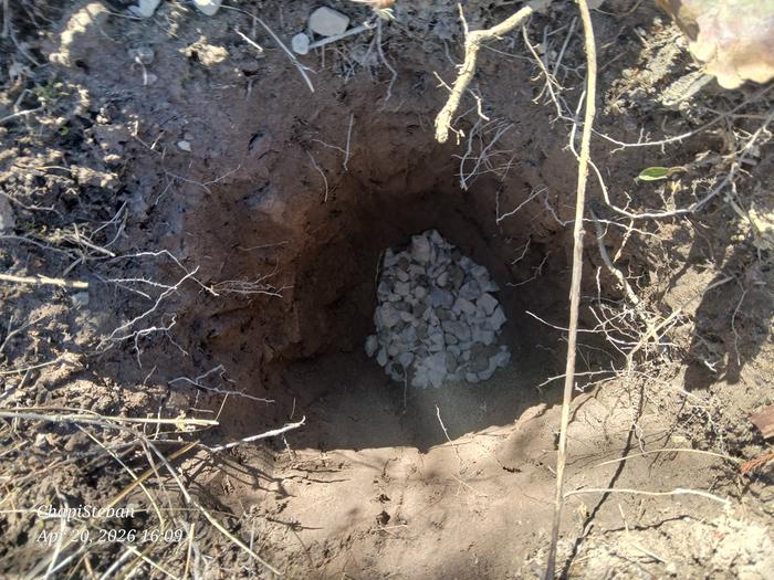 gravel in the bottom of a post hole