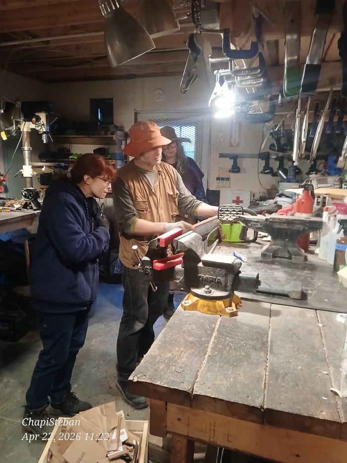 Stephen going over the preventive maintenance with the chainsaws 