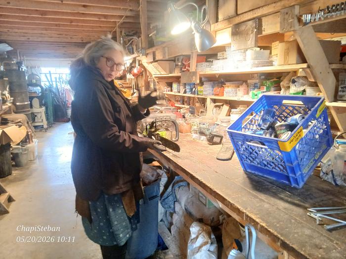 Gravel granny tasked with some chainsaw maintenance and aluminum can processing 